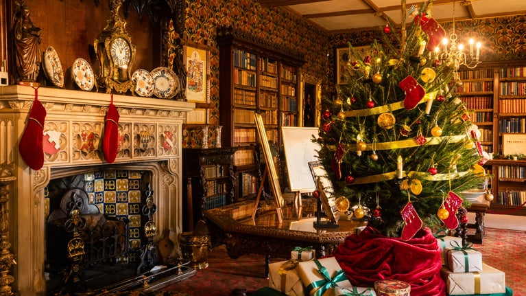 Traditional Christmas decorations in the Library at Oxburgh Estate Norfolk